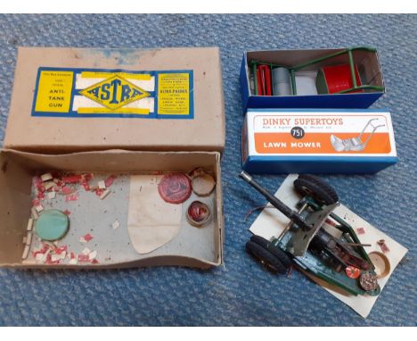 A vintage Astra anti tank gun in original box together with a Dinky Supertoys 751 lawn mower in original boxLocation: 