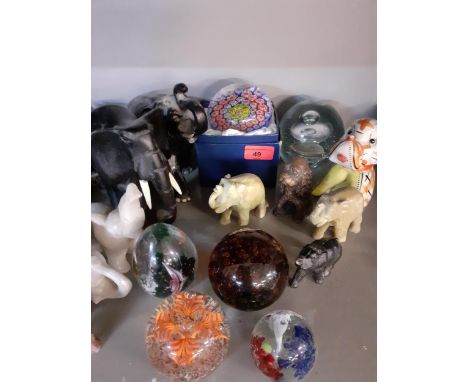 A quantity of glass paperweights to include Caithness and a Mille Fleurie example together with ornamental models of animalsL