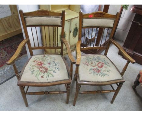 A pair of Edwardian walnut tapestry seated armchairsLocation: 