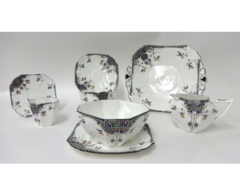 A Shelley 'Black Leafy Tree's' part service comprising a tea cup trio, milk jug, sugar bowl, coffee duo and bread plate, circ