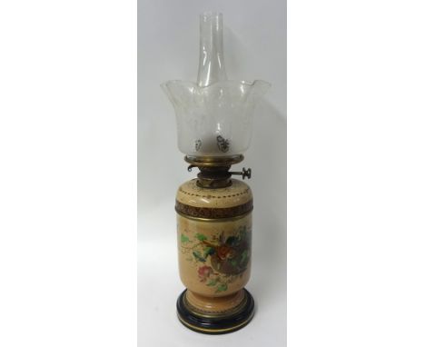 A Victorian oil lamp, Doulton, decorated with flowers, with brass Hink & Sons burner, etched glass shade, 59cm tall