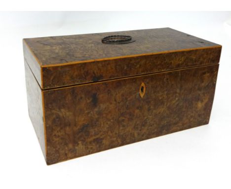 A 19th century burr walnut tea caddy fitted with boxes and mixing bowl