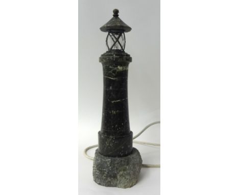 A marble lighthouse with wired fitting and lamp, 35cm