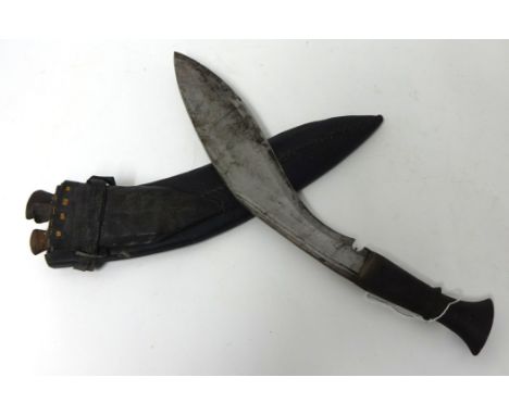 A Kukri knife in scabbard