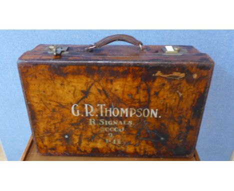 A leather trunk by J.W. Allen, military outfitters, 1798, marked G.R. Thompson, R. Signals, RCCCJ, lacking key 
