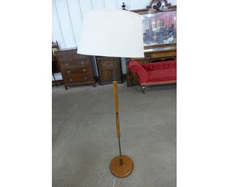 A teak standard lamp 
