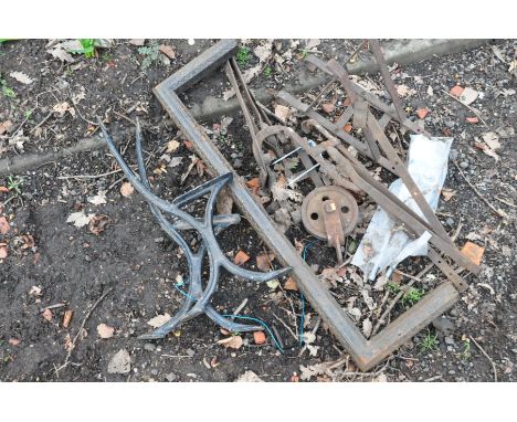 A QUANTITY OF METALWARE to include a pair of black painted cast iron bench ends, wrought iron fender, wall bracket etc (7)