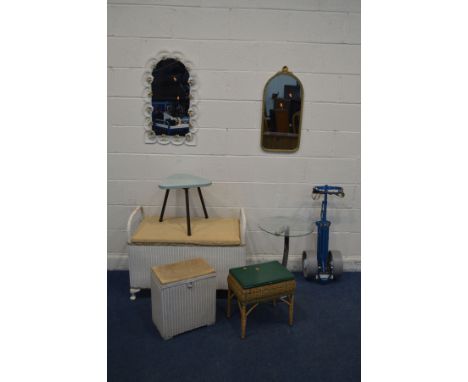 A LLOYD LOOM STYLE WICKER OTTOMAN with twin handles, along with a Lloyd loom linen basket, galvanised trunk, two wall mirrors