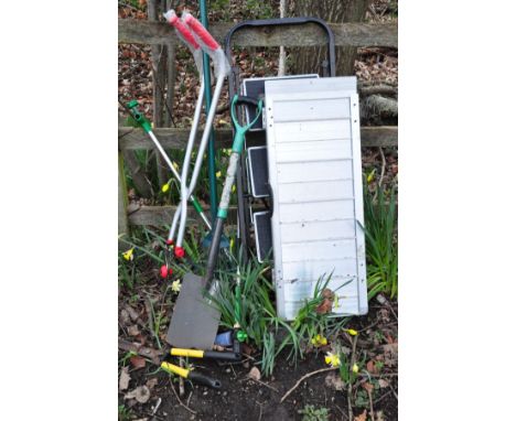 AN ALUMINIUM FOLDING WHEELCHAIR RAMP together with a small set of step ladders, garden spade, rake etc
