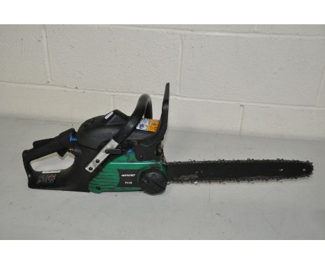 A QUALCAST PC40 PETROL CHAINSAW with 40cm cut ( engine pulls freely but hasn't been started)