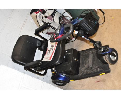 A PRIDE GO GO TRAVELLER DISABLILTY SCOOTER with one key, charger and cover (some damage to armrests)(PAT fail due to taped ca