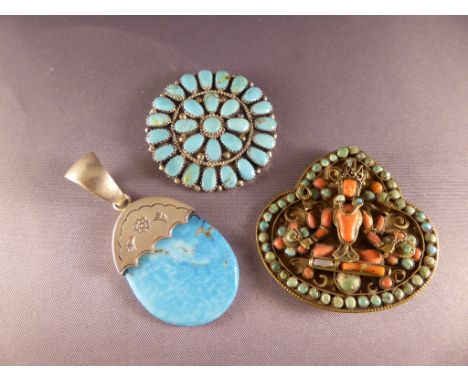 A collection of turquoise pendants, Nepalese Buddha, star burst and silver opal tear drop pendant.