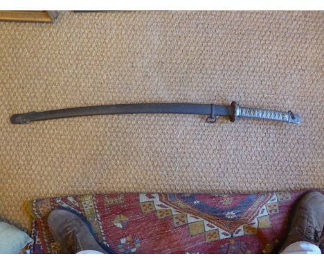 A Japanese WW11 samurai sword with scabbard the rubbed Menukis to handle and pitted blade the pierced Tsuba in good condition