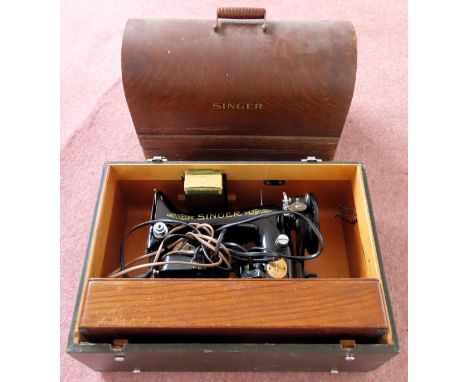 Two vintage cased Singer sewing machines

used and not tested. one case is locked 