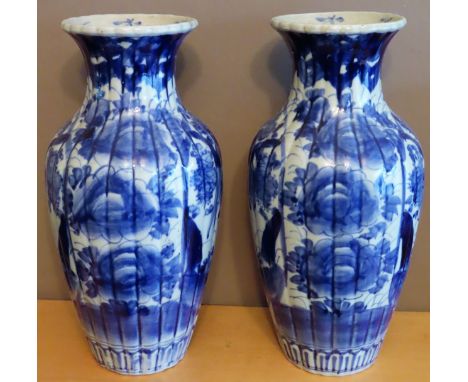 Pair of late 19th century Oriental blue and white glazed ceramic vases. Approx. 30cms H

reasonable used condition 