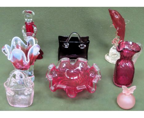 Quantity of cranberry and ruby coloured glass figures, vases, bowl etc

all used and unchecked 