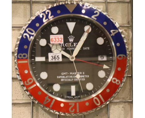 Rolex dealers wall clock with Pepsi bezel, black dial and sweeping seconds hand, D: 34cm. P&amp;P Group 2 (£18+VAT for the fi