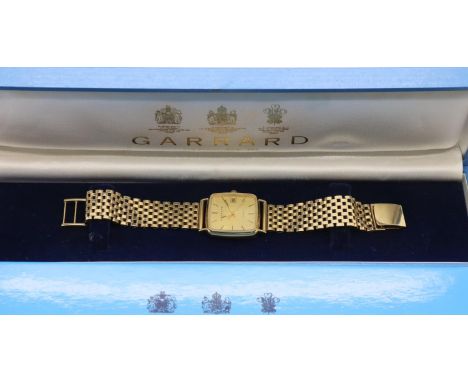 Garrard 9ct gold quartz wristwatch on a 9ct gold bracelet with box and papers, inner and outer box. P&amp;P Group 1 (£14+VAT 
