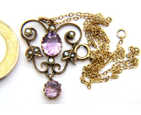 Unmarked gold Edwardian amethyst and seed pearl pendant on a fine 9 ct gold chain. 3.3g.  P&amp;P Group 1 (£14+VAT for the fi