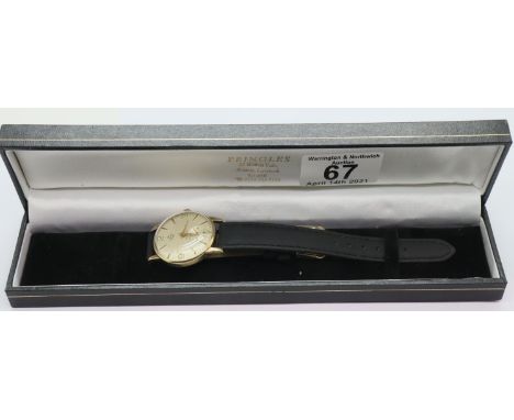 Smiths Deluxe fifteen jewel 9ct gold wristwatch on a leather strap with British Rail 45 years service inscription. P&amp;P Gr