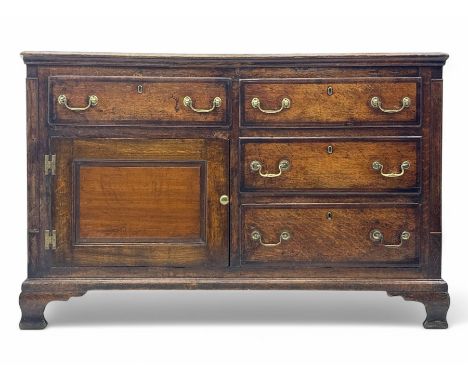Early 19th century century oak and mahogany crossbanded dresser base, rectangular moulded top over asymmetrical arrangement o
