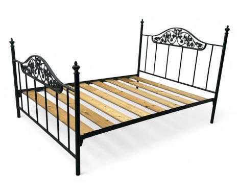Contemporary metal double bed frame, shaped head and footboards with foliate cast panels and vertical rod supports, the corne