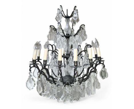 Early 20th century continental cut glass and metal chandelier, with sixteen candle style lights on a single tier of scrolled 