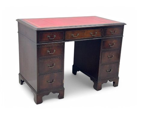 Georgian design mahogany kneehole desk, moulded rectangular top with red gilt-tooled leather writing surface, over an arrange