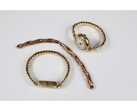 Two 9ct Gold Lady's Wrist Watches. The first rectangular face gold and enamel and other circular with engraved back, both wat