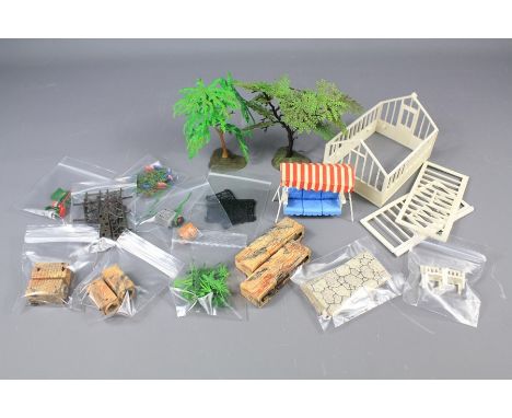 A Britains Vintage Garden Scene. The garden complete with accessories including trees, glass house, lawn mower, grass roller,