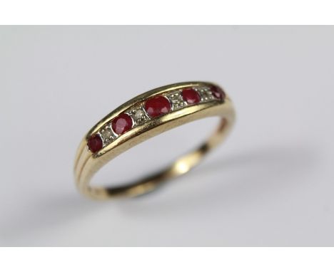 A 9ct Gold Ruby and Diamond Half Eternity Ring. The ring size T, approx 2.5 gms.