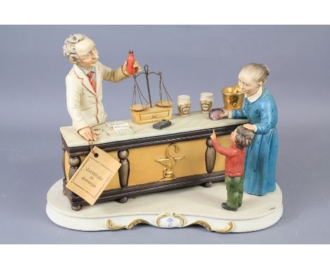 A Capodimonte Porcelain Figural Group. The study depicting a chemist serving clients, from a model by Fornili with Certificat