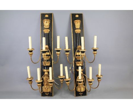 A Pair of Venetian-Style Elaborate Wall Lights. The wall bracket with three light sconces to the upper middle and four light 