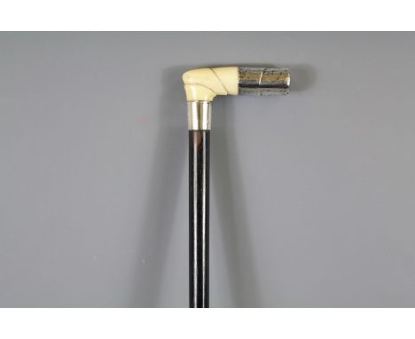 An Antique Silver Topped and Ivory Walking Stick. The stick approx 86 cms long.&nbsp;