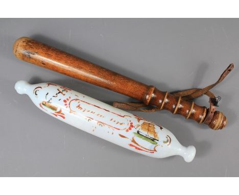 Glass Victorian Rolling Pin and Truncheon. The rolling pin (paint decoration faded) approx 32 cms long, the wooden truncheon 