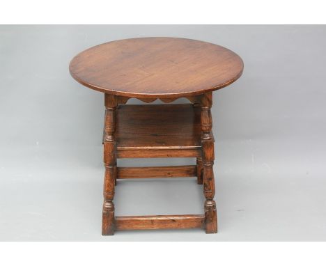 Antique Oak Reproduction Tavern Table. The table with a lower shelf, on turned legs with stretchers, approx 61 cms d x 58 cms