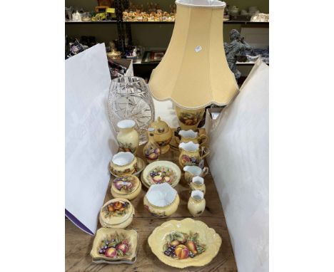 Nineteen pieces of Aynsley Orchard Gold including table lamp, and large crystal vase.