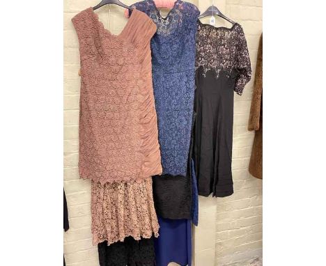 Collection of ladies vintage lace work evening gowns.