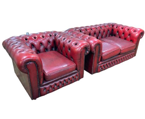 Red leather button back Chesterfield settee and chair.