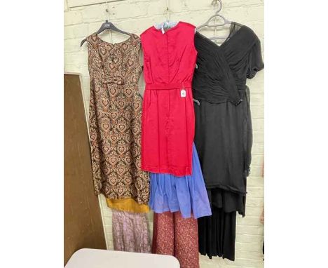 Collection of ladies vintage evening gowns.