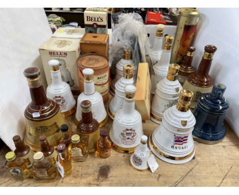 Collection of 15 Bells Scotch Whisky decanters and bottles, 28 pieces in total.