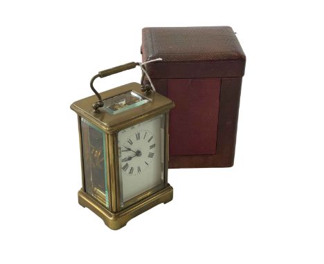 Gilt brass carriage clock with case and key.