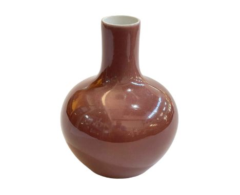 Chinese bottle vase in plum glaze, seal mark to base, 18cm.