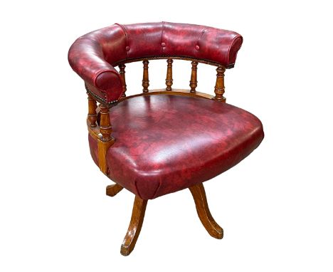 Red leather button back and oak swivel office chair.