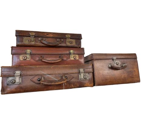 Four vintage leather cases.