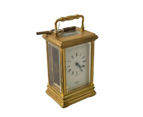 St James, London, gilt brass carriage clock, 15cm to top of handle.