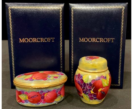 A Moorcroft miniature Pomegranate pattern enamel miniature ginger jar and cover, 9cm, boxed; a Pomegranate pattern oval ename