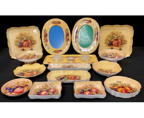 A pair of Aynsley Orchard Gold pattern oval photograph frames, printed with ripe fruits, 24cm; a tea light tray, pedestal bon