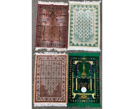 An Islamic woollen prayer mat/rug, depicting a mosque in shades of green and yellow, with a compass pointing to Mecca, approx