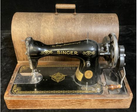 A Singer sewing machine, manual, wooden case 